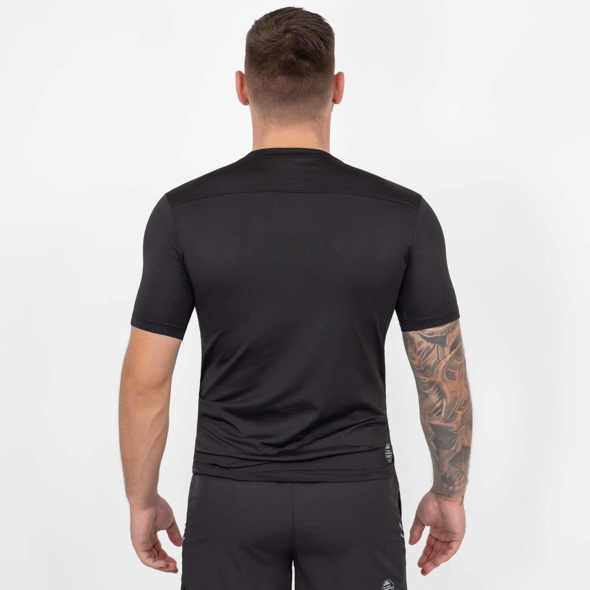 FFX Compression Rashguard Precise Control by FEFLOGX Sportswear, super komfortabel & mega Top stylisches Design, Sportshirt, Sport Shirt, Fight Shirt, MMA Rashguard, Kompressionsshirt Herren, Farben: schwarz, grün, weiß, hintere Ansicht des schwarzen Sportshirts. FFX Compression Rashguard Precise Control
