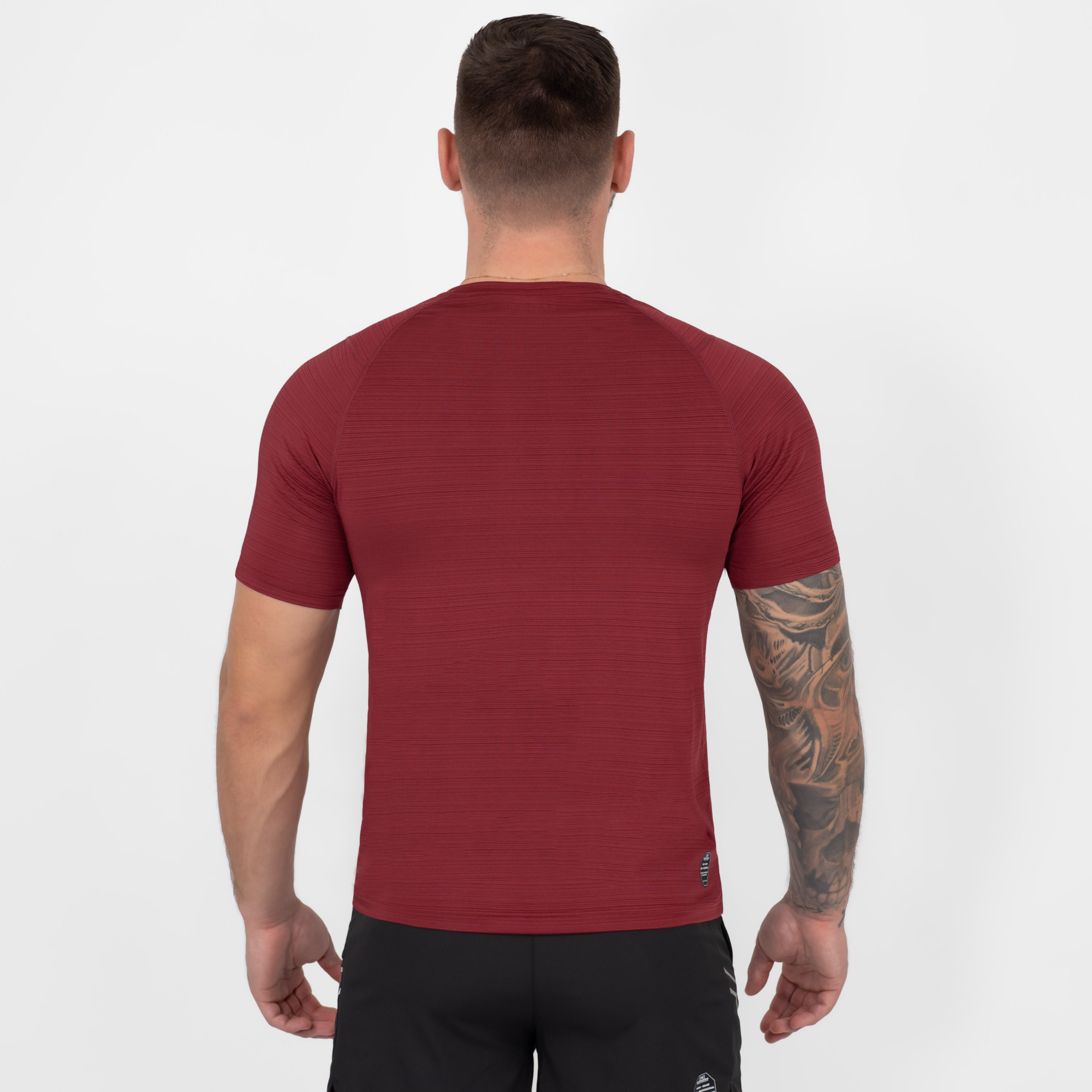 FFX Stretch Sportshirt Fighting Force by FEFLOGX Sportswear, super komfortabel & mega Top stylisches Design, Sport Shirt, Laufshirt, Gym Shirt, MMA Shirt, Rashguard, sretchiges Fighting Fitness Shirt Farben: schwarz, grau, blau, rot, hintere Ansicht des roten stretch Sportshirts. FFX Stretch Sportshirt Fighting Force