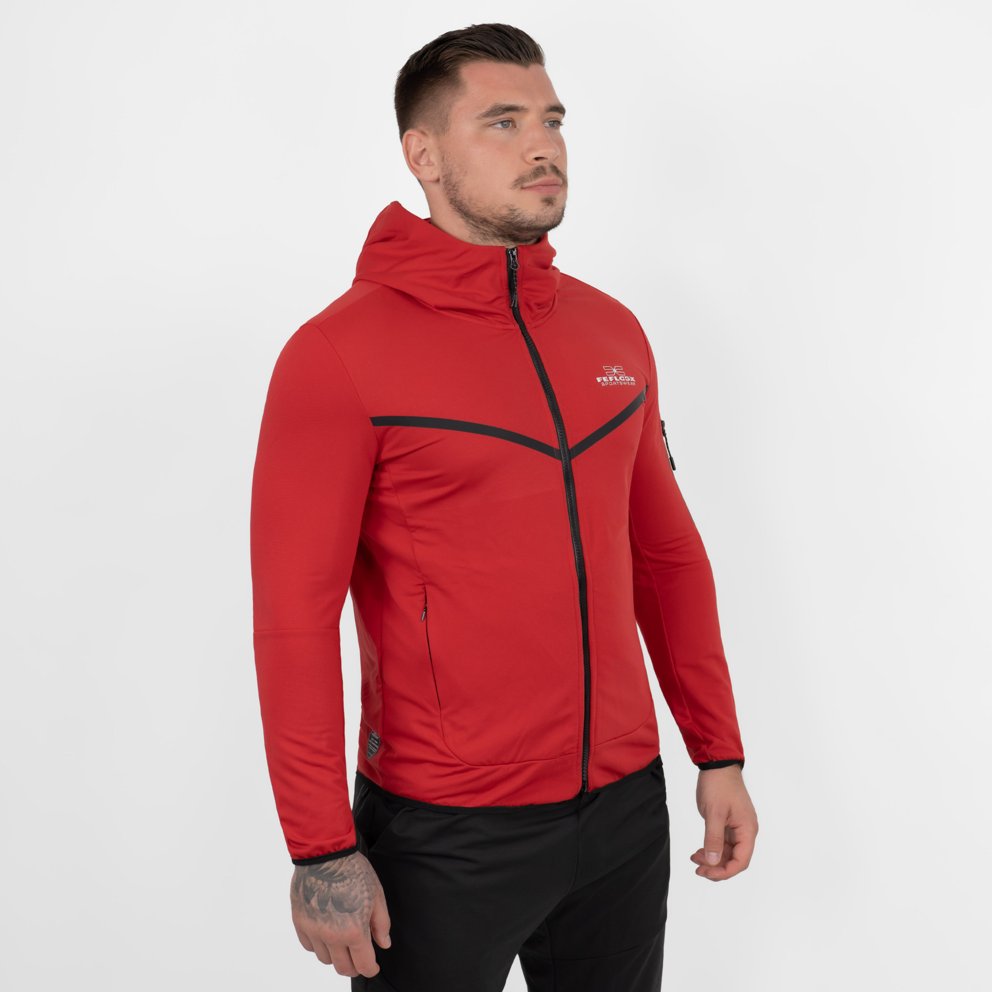 FFX Superior Kapuzen Trainingsjacke Absolute Power by FEFLOGX Sportswear, Teil des Trainingsanzug: FFX Superior Jogginganzug Absolute Power, Top-Style Zip-Hoodie, Jacke mit Kapuze, Zip Hoody, Zipper Hoodie, Sport Jacke, Freizeit Jacke, Kapuzenpullover mit Reißverschluss, Farben schwarz & rot, seitlich vordere Ansicht der roten Trainingsjacke mit Kapuze. FFX Superior Kapuzen Trainingsjacke Absolute Power